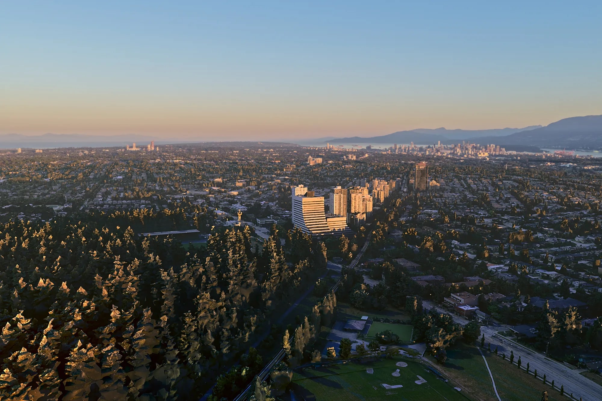 The imported 3D city of the same site in early-morning light, seen through the drone camera ValTerra built from the photo: forest in front, towers and the city centre towards the horizon.