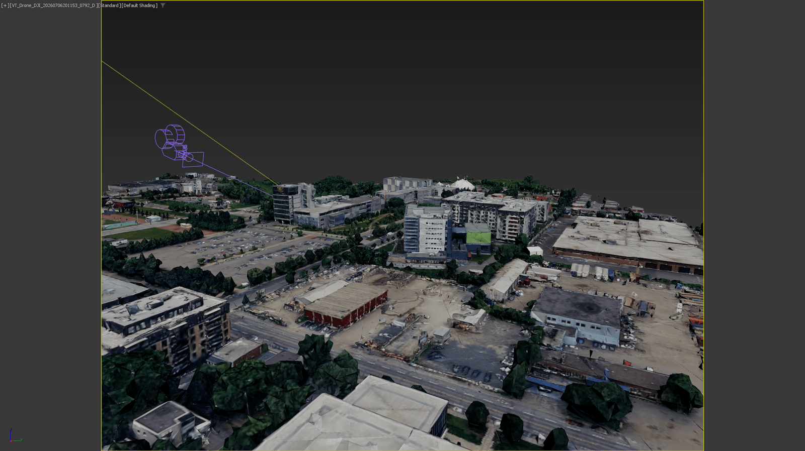 The 3ds Max viewport seen through a camera matched to a drone photograph, with the camera gizmo visible.